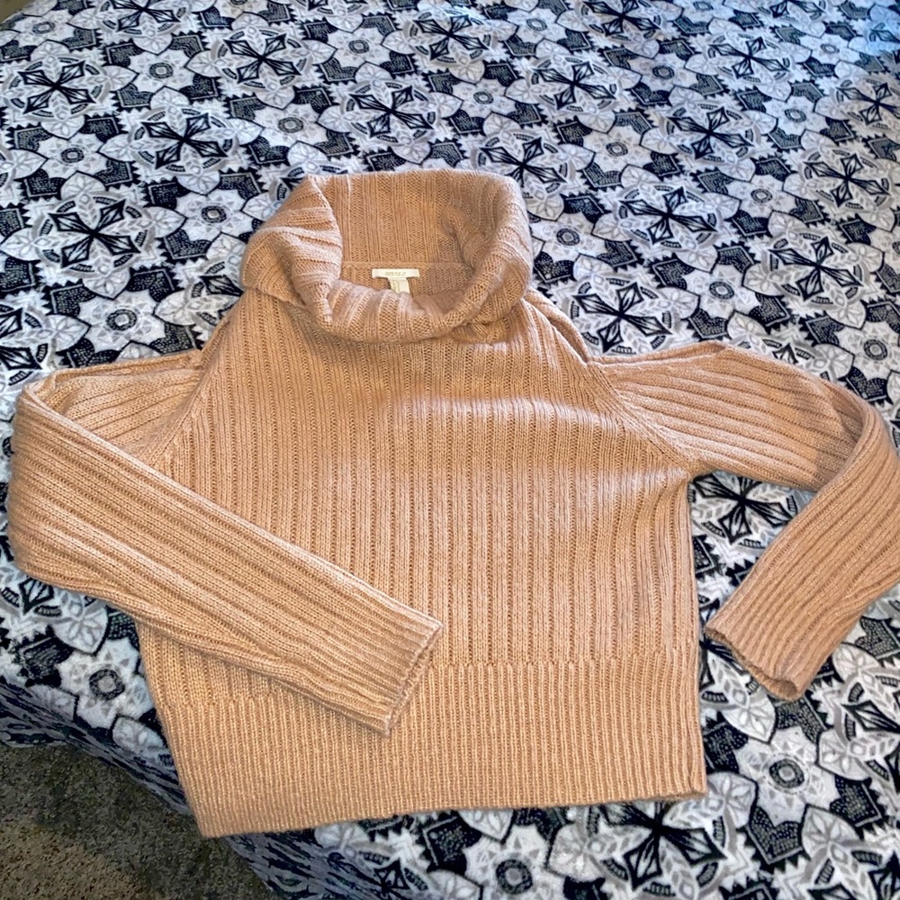 Pink turtle neck with open shoulder